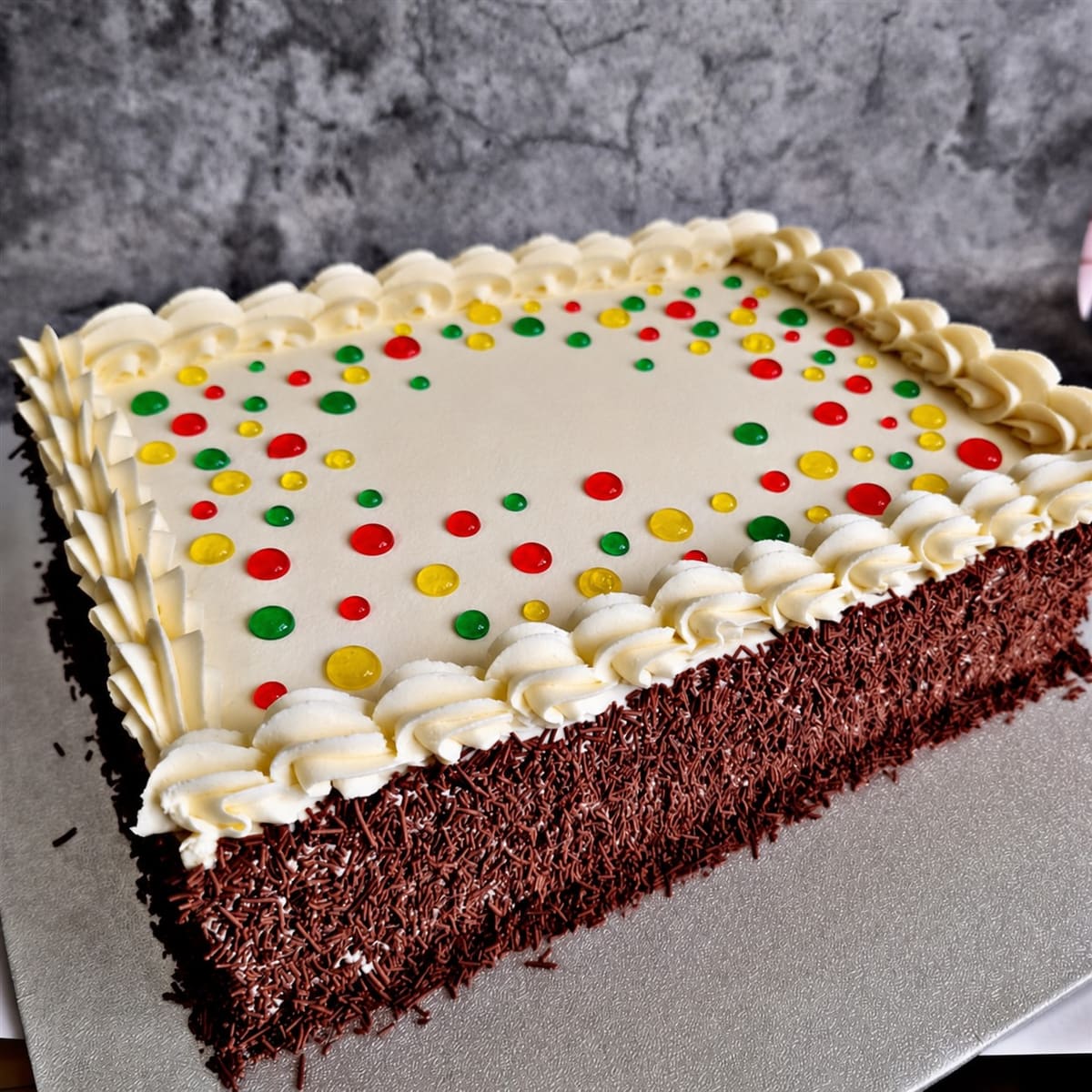 Old-school buttercream birthday cake with colourful sprinkles